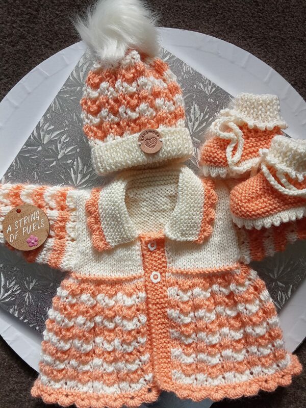baby handknitted going home outfit